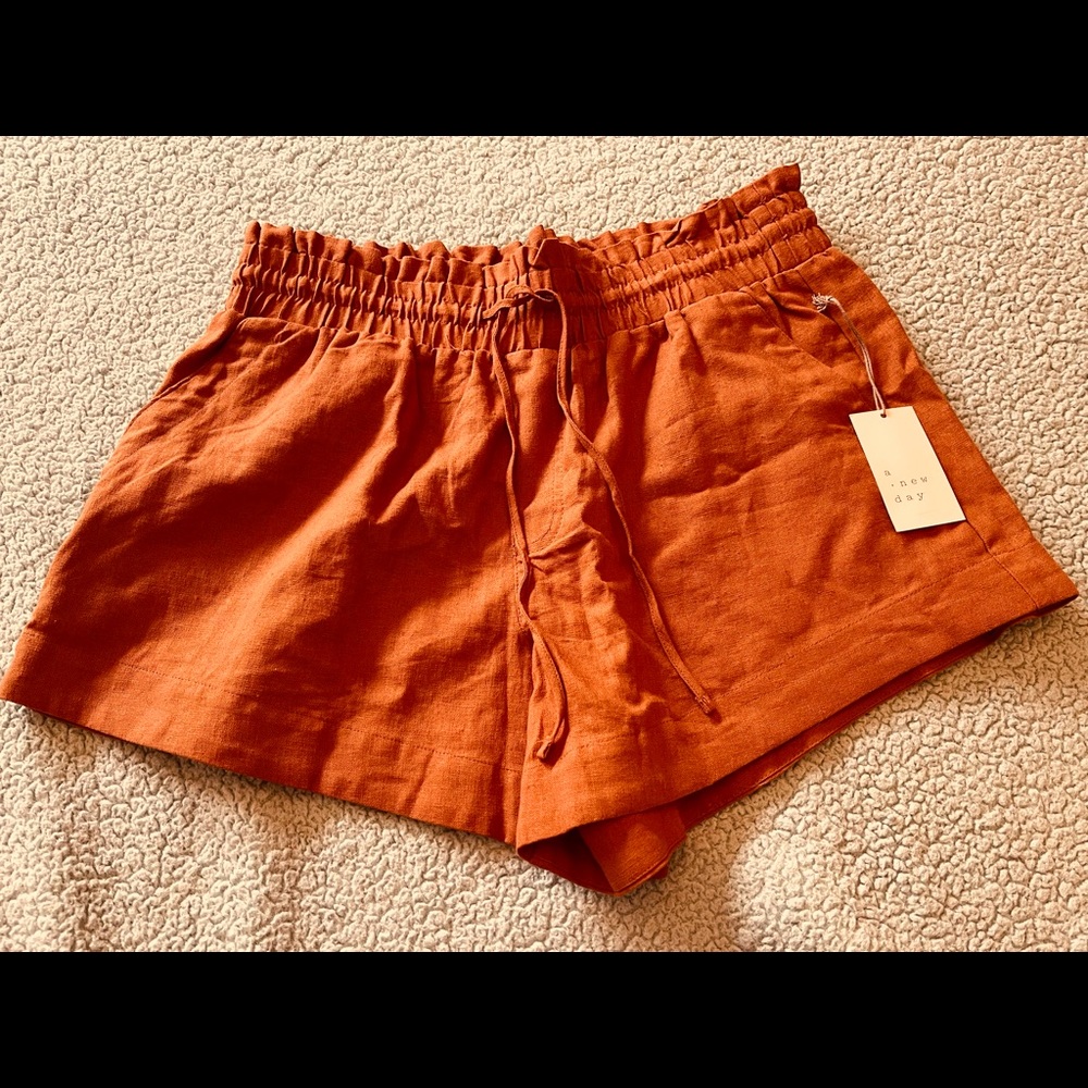 Brand new rust shorts with pockets, elastic waist & draw string